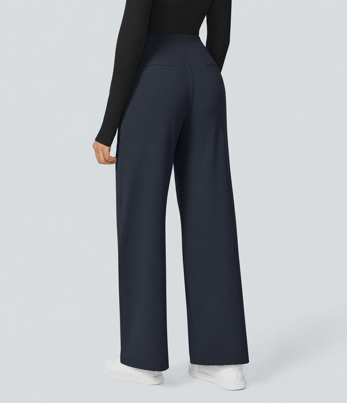 Black top styled with midnight blue straight-leg work pants